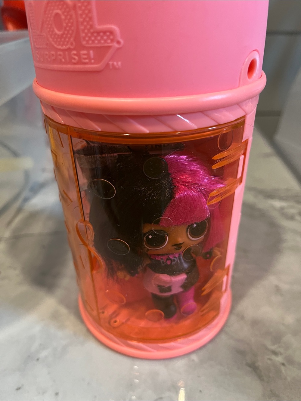 L.O.L. Surprise! Pink & Black Doll in Pink Capsule with Orange Window